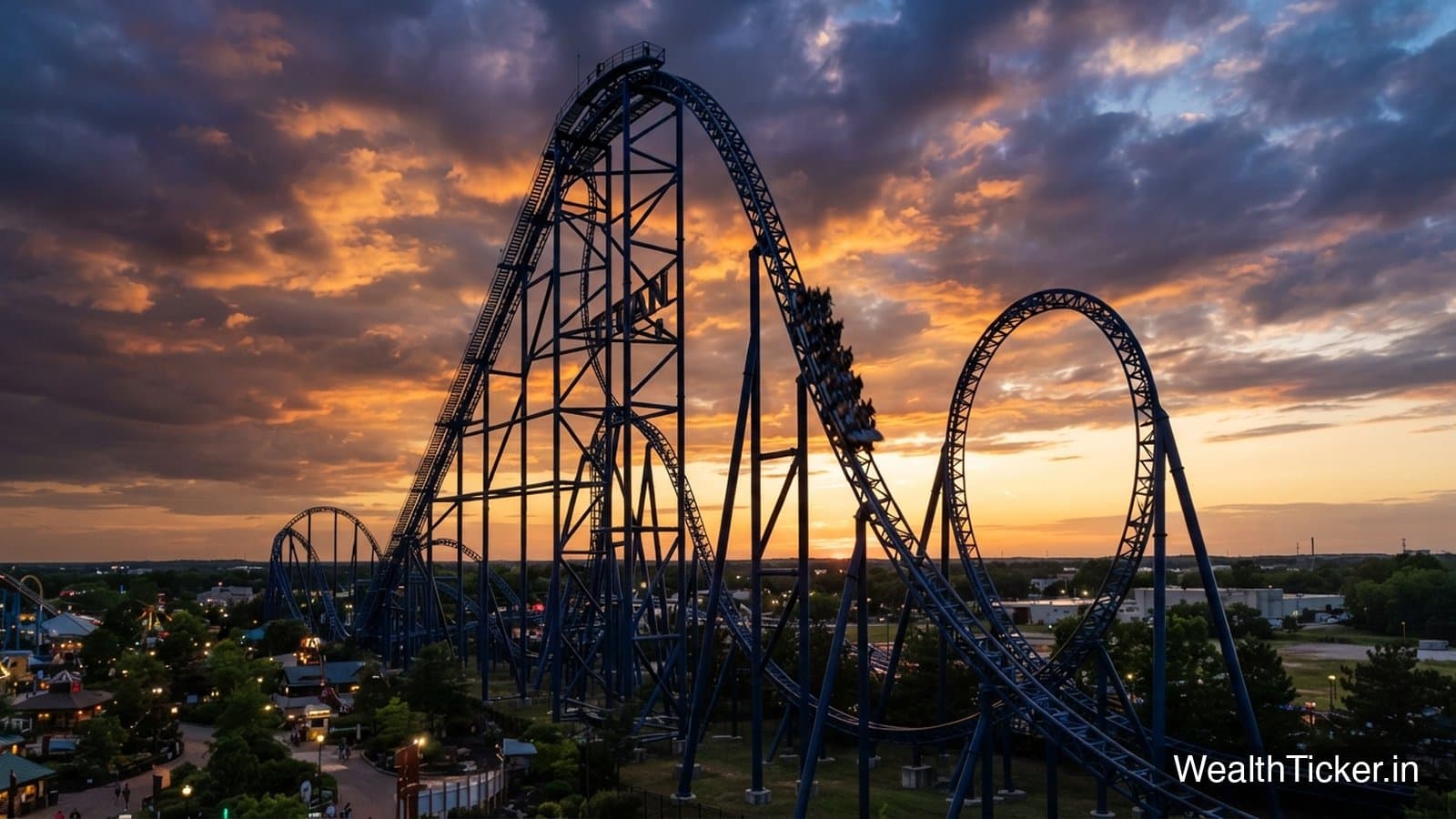 A roller coaster with steep drops and loops against an evening sky